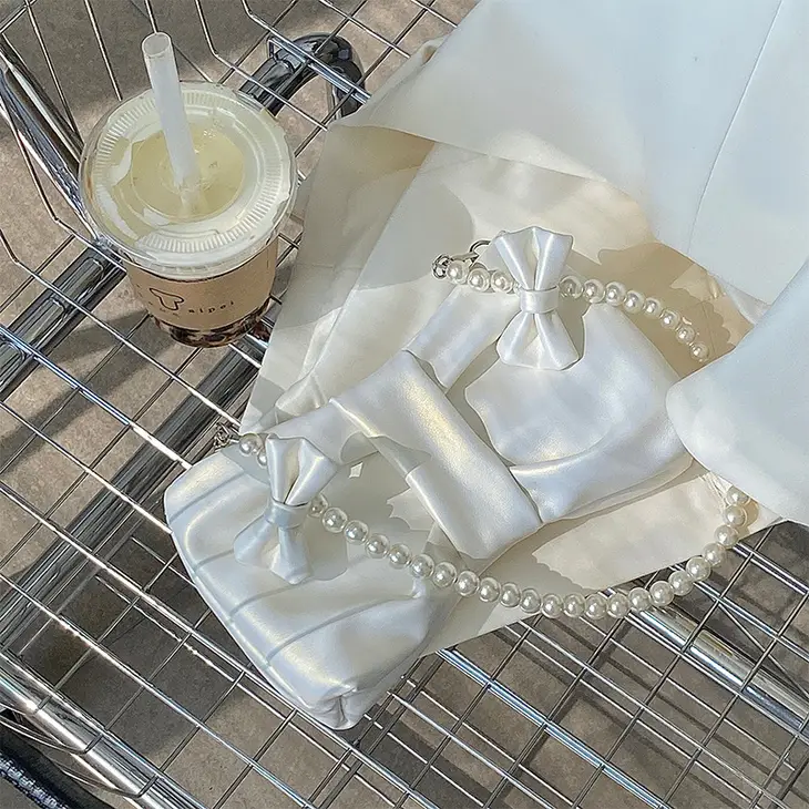 Large Bow Shimmery Handbag with Pearl Handle